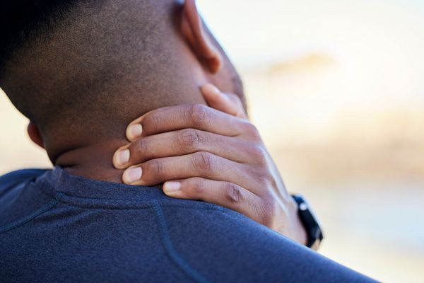 man experiencing neck and shoulder pain in Bryant Arkansas